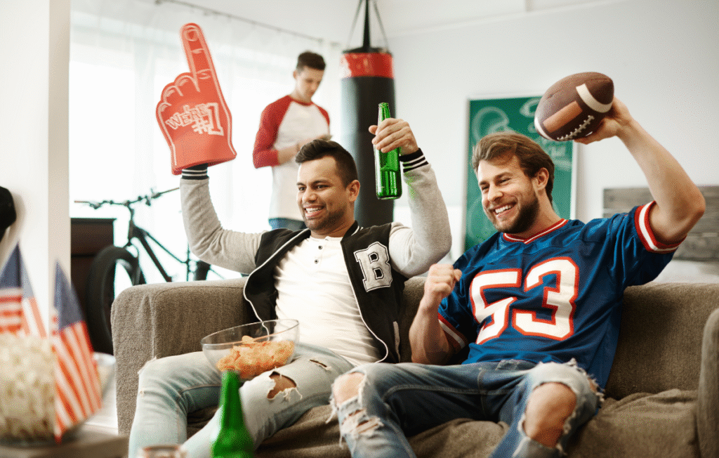 sports fans enjoying the game in a new room addition built by P&A Construction