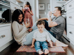 Tennessee family laughing and spending time on the floor of their new kitchen